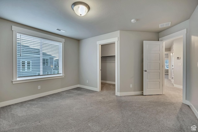 2508 E Lone Hill Dr, Draper Ut Cnty, UT 84020 - unfurnished bedroom with carpet floors, a spacious closet, and a closet