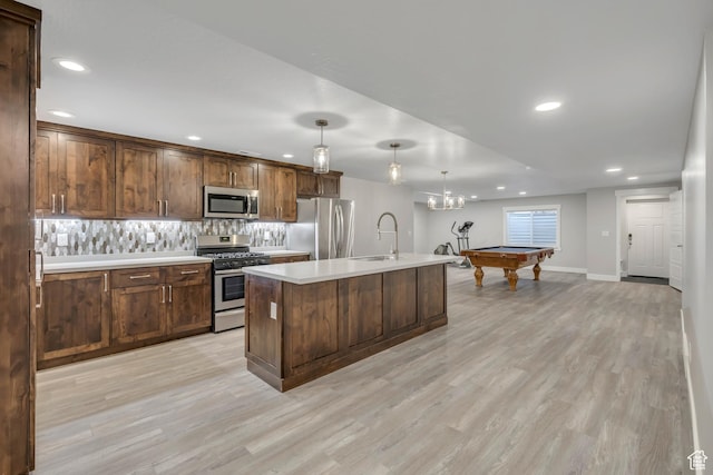 2508 E Lone Hill Dr, Draper Ut Cnty, UT 84020 - kitchen featuring stainless steel appliances, recessed lighting, light countertops, billiards table, and light wood-style floors
