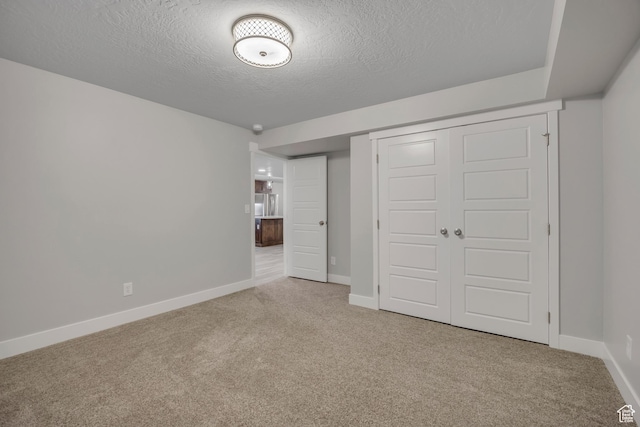 2508 E Lone Hill Dr, Draper Ut Cnty, UT 84020 - unfurnished bedroom featuring carpet flooring, a textured ceiling, and a closet