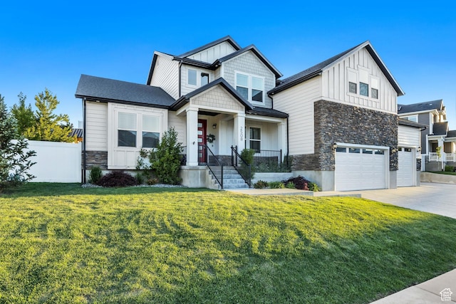 2508 E Lone Hill Dr, Draper Ut Cnty, UT 84020 - craftsman-style house with stone siding, board and batten siding, a garage, and driveway