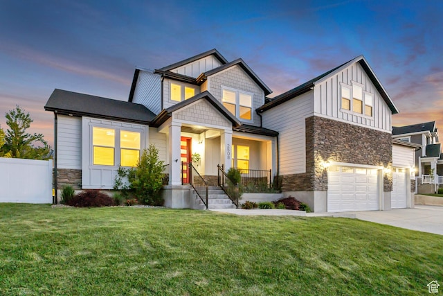 2508 E Lone Hill Dr, Draper Ut Cnty, UT 84020 - craftsman inspired home with stone siding, board and batten siding, a garage, driveway, and covered porch