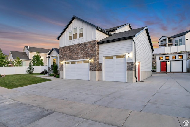 2508 E Lone Hill Dr, Draper Ut Cnty, UT 84020 - view of side of home featuring stone siding, concrete driveway, board and batten siding, and an attached garage