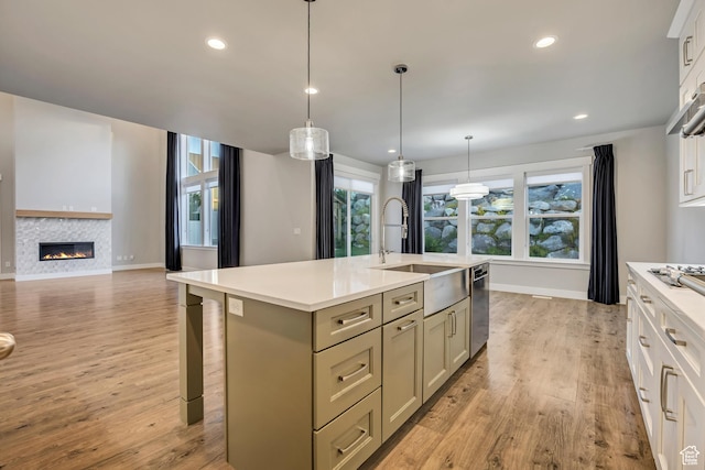 2508 E Lone Hill Dr, Draper Ut Cnty, UT 84020 - kitchen featuring light countertops, healthy amount of natural light, light wood-type flooring, and recessed lighting