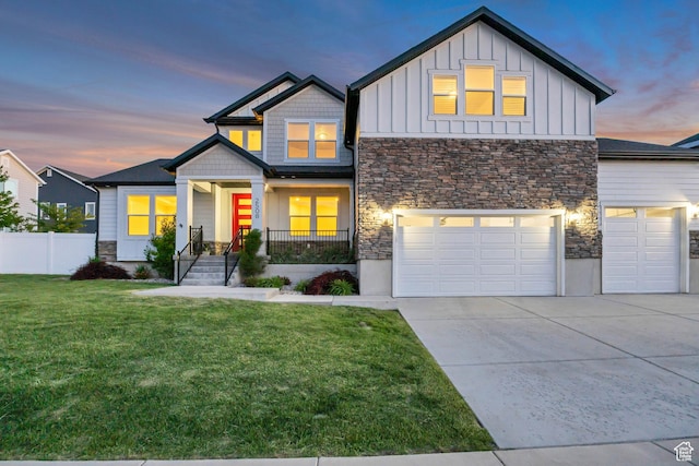 2508 E Lone Hill Dr, Draper Ut Cnty, UT 84020 - view of front facade with stone siding, board and batten siding, a garage, and concrete driveway