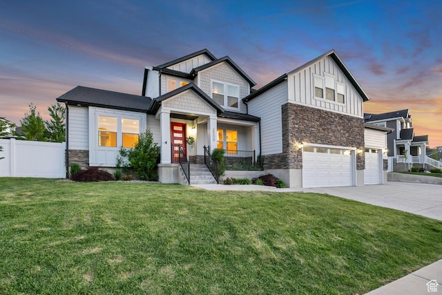 2508 E Lone Hill Dr, Draper Ut Cnty, UT 84020 - view of front facade with stone siding, board and batten siding, a garage, and concrete driveway