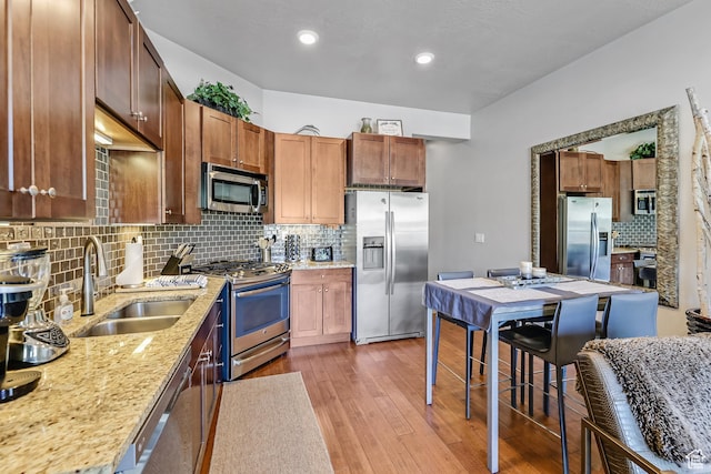6169 E Park Ln S Unit 30, Park City, UT 84098 - kitchen with stainless steel appliances, decorative backsplash, dark wood-type flooring, light stone countertops, and recessed lighting