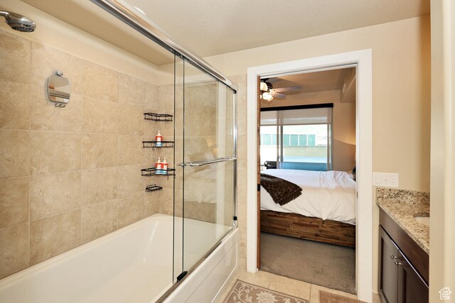 6169 E Park Ln S Unit 30, Park City, UT 84098 - ensuite bathroom featuring vanity, bath / shower combo with glass door, a ceiling fan, and tile patterned flooring