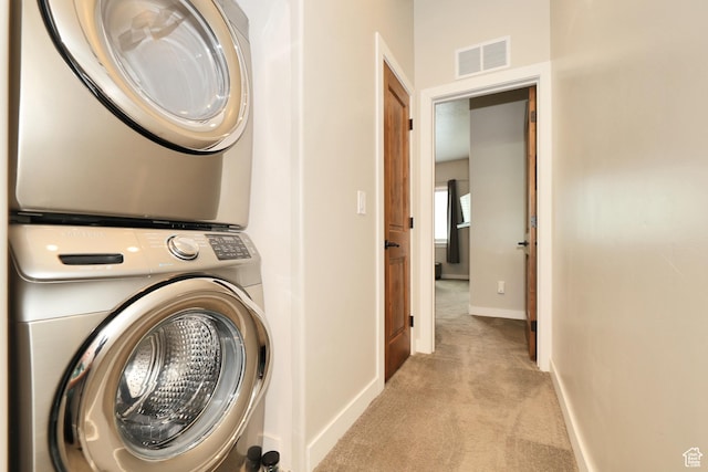 6169 E Park Ln S Unit 30, Park City, UT 84098 - washroom with stacked washer / drying machine and carpet floors