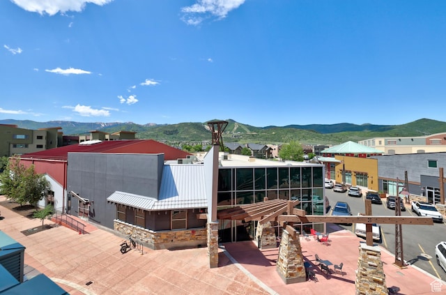 6169 E Park Ln S Unit 30, Park City, UT 84098 - back of house with a mountain view, a metal roof, and stone siding