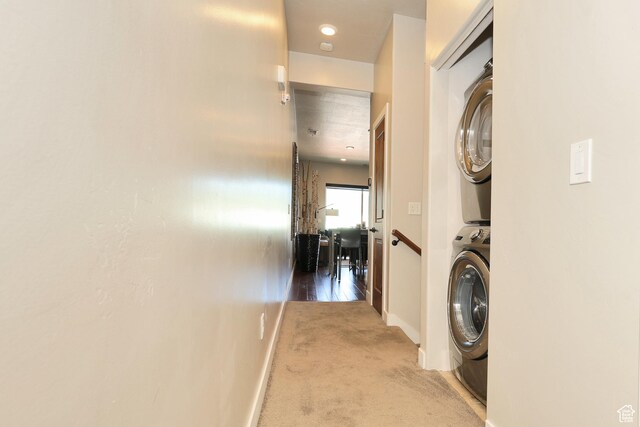 6169 E Park Ln S Unit 30, Park City, UT 84098 - laundry area featuring estacked washer and dryer and carpet