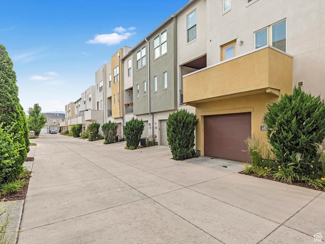 4851 W Daybreak Pkwy, South Jordan, UT 84009 - view of property with a garage, a residential view, and concrete driveway