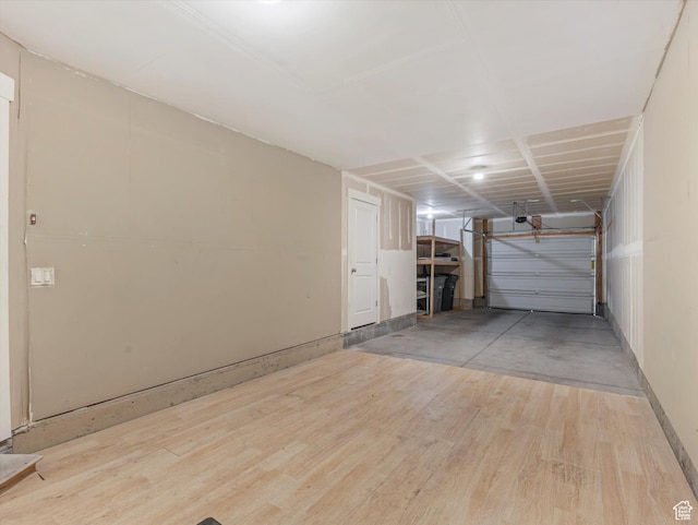 4851 W Daybreak Pkwy, South Jordan, UT 84009 - garage featuring a garage door opener and baseboards