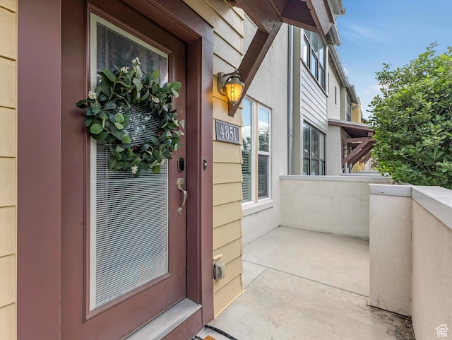 4851 W Daybreak Pkwy, South Jordan, UT 84009 - doorway to property with stucco siding
