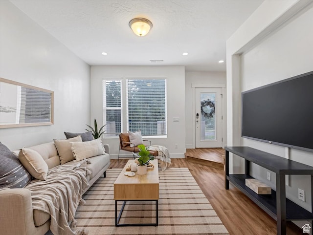 4851 W Daybreak Pkwy, South Jordan, UT 84009 - living area featuring wood finished floors and recessed lighting