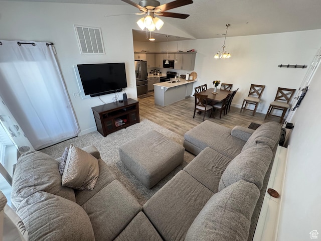 949 W Big Ben Ln Unit I304, Saratoga Springs, UT 84045 - living room with a ceiling fan, lofted ceiling, a chandelier, and light wood-style flooring