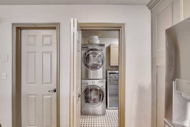 44 W Broadway S Unit 2005S, Salt Lake City, UT 84101 - laundry room featuring stacked washer / dryer, beverage cooler, and cabinet space