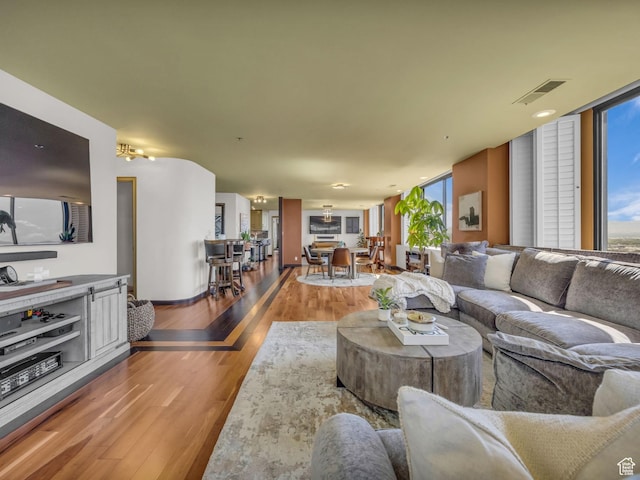 44 W Broadway S Unit 2005S, Salt Lake City, UT 84101 - living room with wood finished floors and a wall of windows
