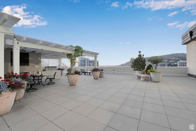 44 W Broadway S Unit 2005S, Salt Lake City, UT 84101 - view of patio / terrace featuring a pergola, a mountain view, and outdoor dining space