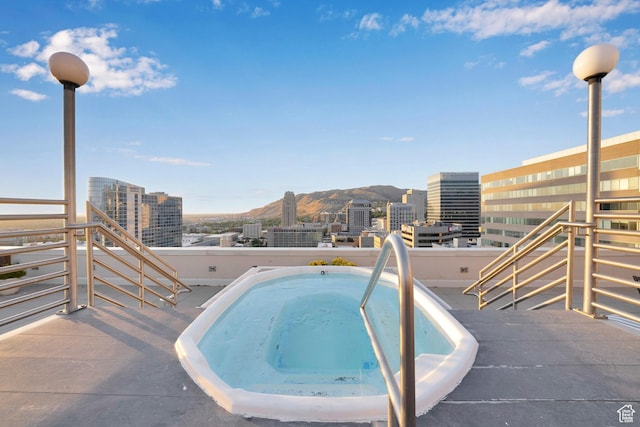 44 W Broadway S Unit 2005S, Salt Lake City, UT 84101 - view of pool with a city view, a jacuzzi, and a mountain view