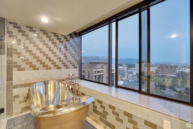 44 W Broadway S Unit 2005S, Salt Lake City, UT 84101 - bathroom with floor to ceiling windows, tile patterned flooring, a city view, and a mountain view