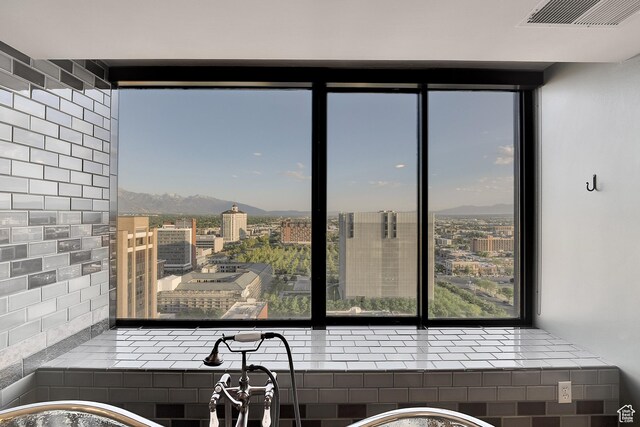 44 W Broadway S Unit 2005S, Salt Lake City, UT 84101 - kitchen with healthy amount of natural light, a mountain view, and a city view