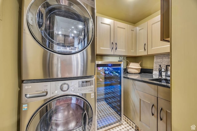 44 W Broadway S Unit 2005S, Salt Lake City, UT 84101 - laundry room featuring beverage cooler, estacked washer and dryer, cabinet space, and tile patterned flooring