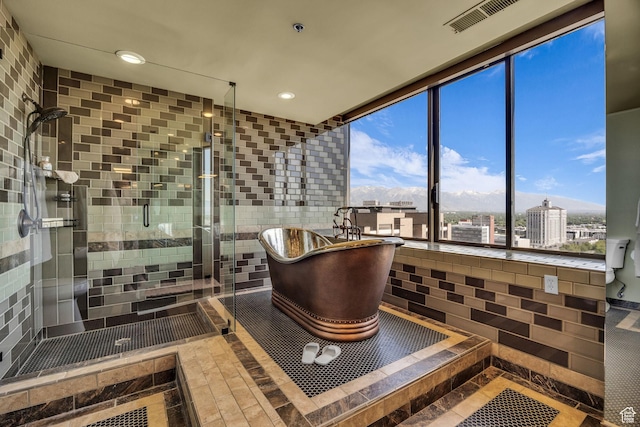 44 W Broadway S Unit 2005S, Salt Lake City, UT 84101 - full bath with inlaid floor details, a freestanding bath, a stall shower, and recessed lighting