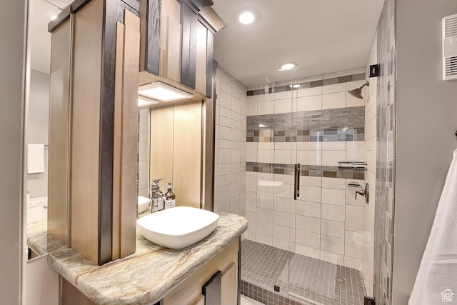 44 W Broadway S Unit 2005S, Salt Lake City, UT 84101 - bathroom featuring a shower stall, vanity, and recessed lighting