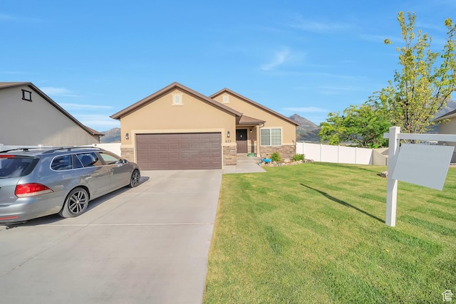 633 Little Rock Dr, Santaquin, UT 84655 - single story home featuring concrete driveway, stone siding, a garage, and stucco siding