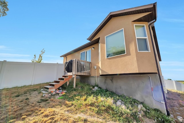 633 Little Rock Dr, Santaquin, UT 84655 - view of side of home featuring stairway and stucco siding