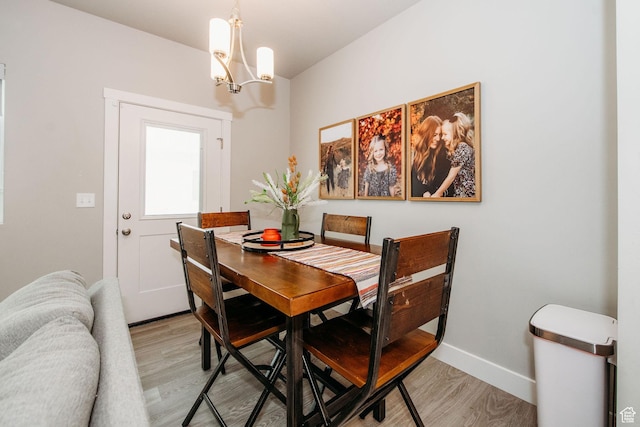 2726 S 2250 W Unit 218, West Haven, UT 84401 - dining area featuring a chandelier and light wood finished floors
