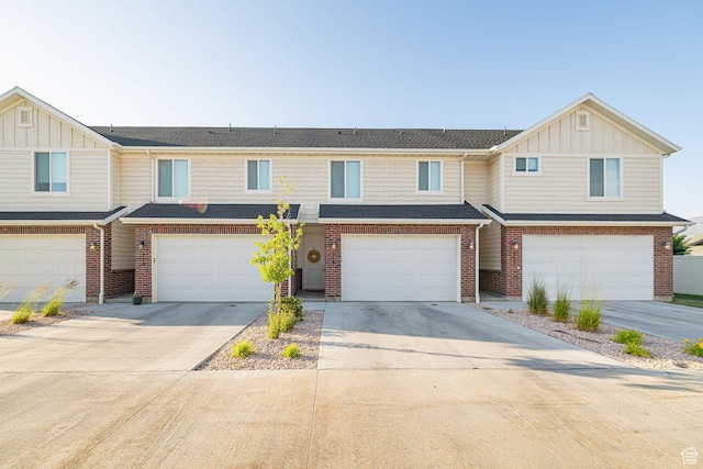 2726 S 2250 W Unit 218, West Haven, UT 84401 - townhome / multi-family property featuring board and batten siding, a garage, driveway, and brick siding