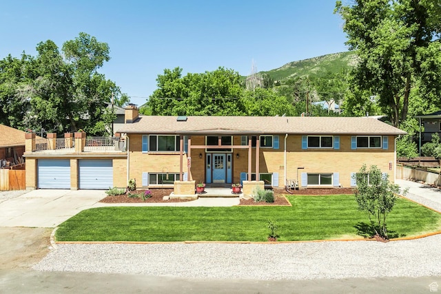 32 S Smokey Ln, Emigration Canyon, UT 84108 - raised ranch with driveway, a mountain view, a chimney, and a balcony