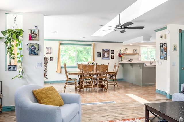 32 S Smokey Ln, Emigration Canyon, UT 84108 - dining area with ceiling fan, a skylight, and light tile patterned floors