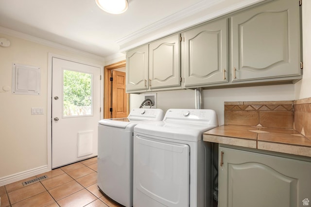 32 S Smokey Ln, Emigration Canyon, UT 84108 - laundry area with cabinet space, washing machine and clothes dryer, light tile patterned floors, ornamental molding, and electric panel
