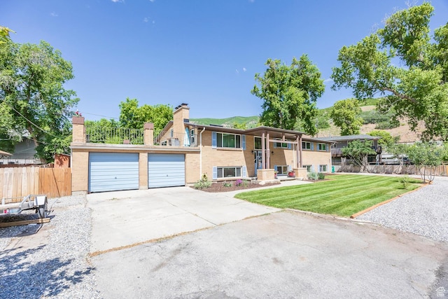 32 S Smokey Ln, Emigration Canyon, UT 84108 - bi-level home featuring a chimney, a garage, and brick siding