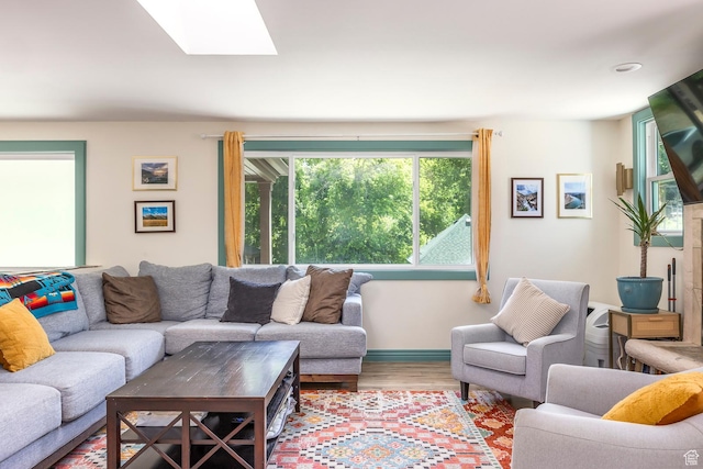32 S Smokey Ln, Emigration Canyon, UT 84108 - living room featuring a skylight and wood finished floors