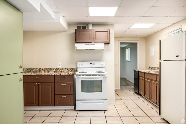 32 S Smokey Ln, Emigration Canyon, UT 84108 - kitchen featuring white appliances, under cabinet range hood, a paneled ceiling, light tile patterned flooring, and light stone countertops