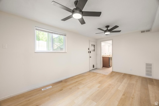 32 S Smokey Ln, Emigration Canyon, UT 84108 - empty room featuring a ceiling fan and light wood-style floors