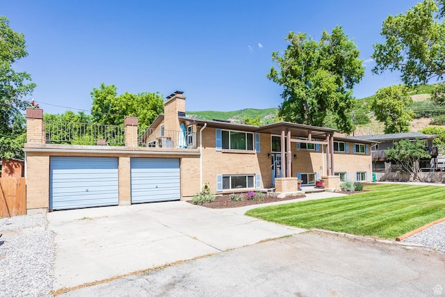32 S Smokey Ln, Emigration Canyon, UT 84108 - bi-level home featuring a chimney, brick siding, and driveway