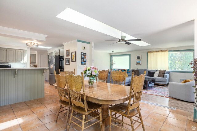 32 S Smokey Ln, Emigration Canyon, UT 84108 - dining space with a skylight, light tile patterned flooring, and ceiling fan
