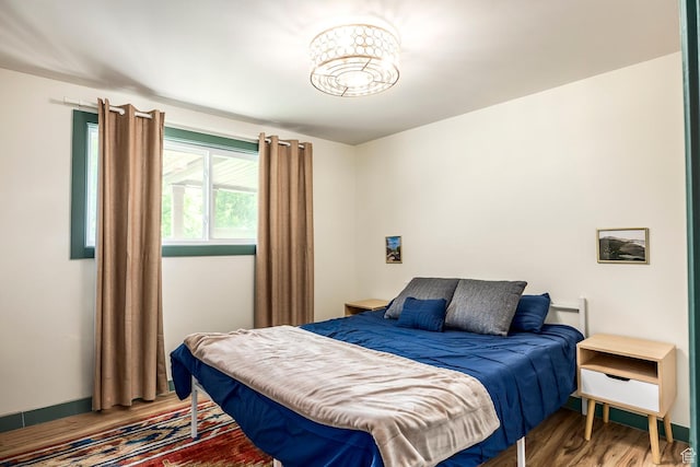 32 S Smokey Ln, Emigration Canyon, UT 84108 - bedroom featuring wood finished floors and baseboards