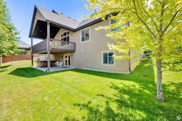 385 E 1000 S Unit 42, Salem, UT 84653 - rear view of property featuring a hot tub, a patio area, and stucco siding