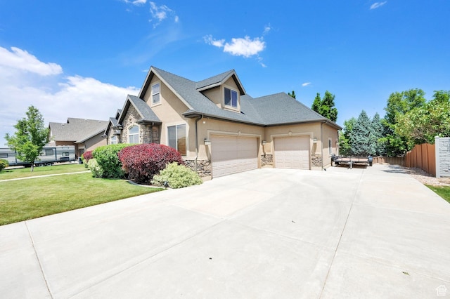 385 E 1000 S Unit 42, Salem, UT 84653 - view of front of property with stone siding, stucco siding, concrete driveway, and a garage