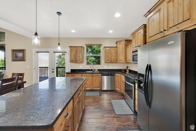 385 E 1000 S Unit 42, Salem, UT 84653 - kitchen with stainless steel appliances, dark wood-style floors, a kitchen island, recessed lighting, and decorative light fixtures