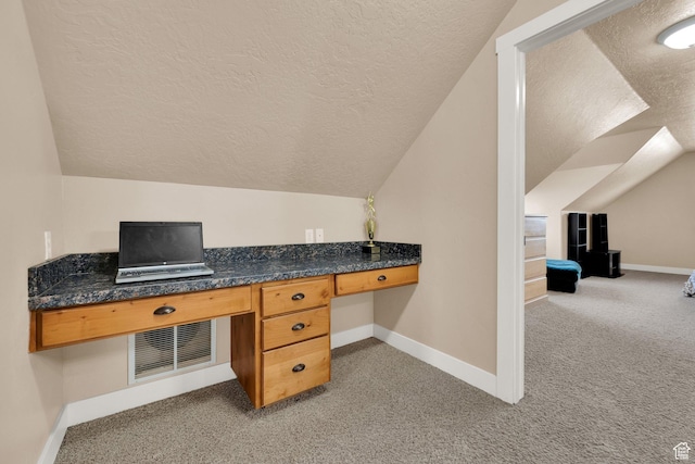 385 E 1000 S Unit 42, Salem, UT 84653 - unfurnished office featuring a textured ceiling, vaulted ceiling, light colored carpet, and built in desk