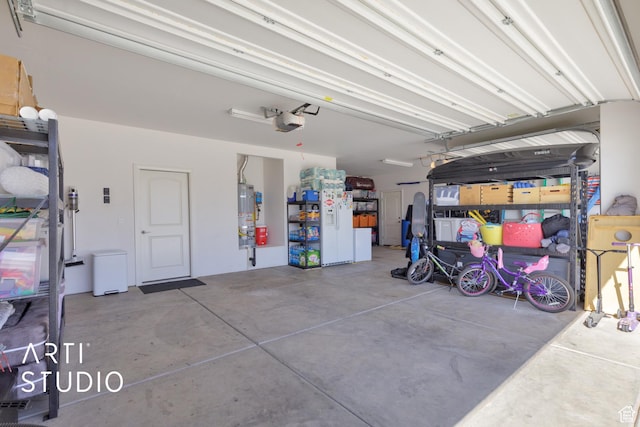 3694 E Tauri Way, St George, UT 84790 - garage featuring a garage door opener and water heater