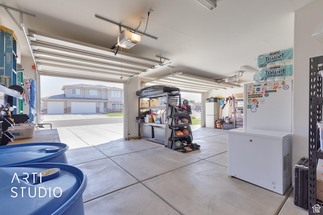 3694 E Tauri Way, St George, UT 84790 - garage with a garage door opener and refrigerator