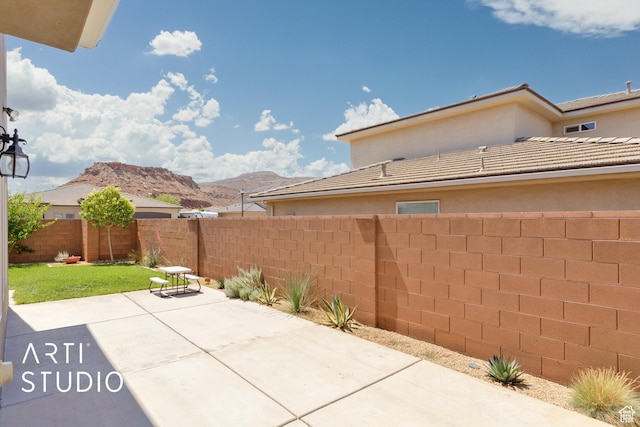 3694 E Tauri Way, St George, UT 84790 - fenced backyard featuring a patio area and a mountain view