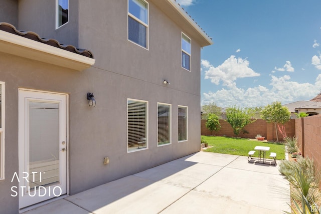 3694 E Tauri Way, St George, UT 84790 - rear view of house featuring stucco siding, a fenced backyard, and a patio